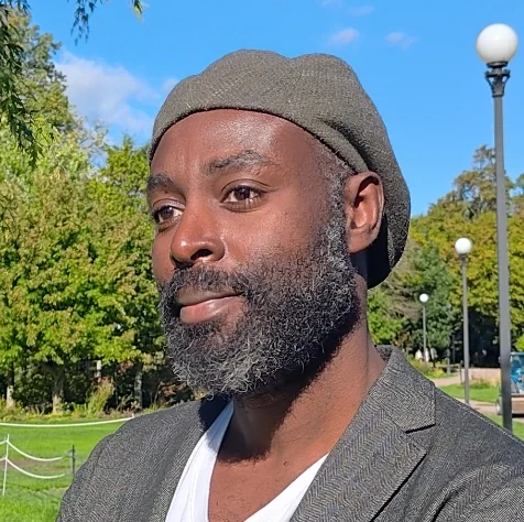 Headshot of Junior Asante headshot